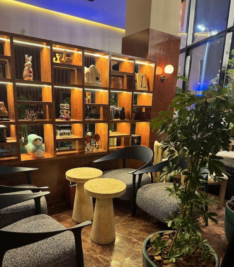 MOOMA interior — warm amber shelving